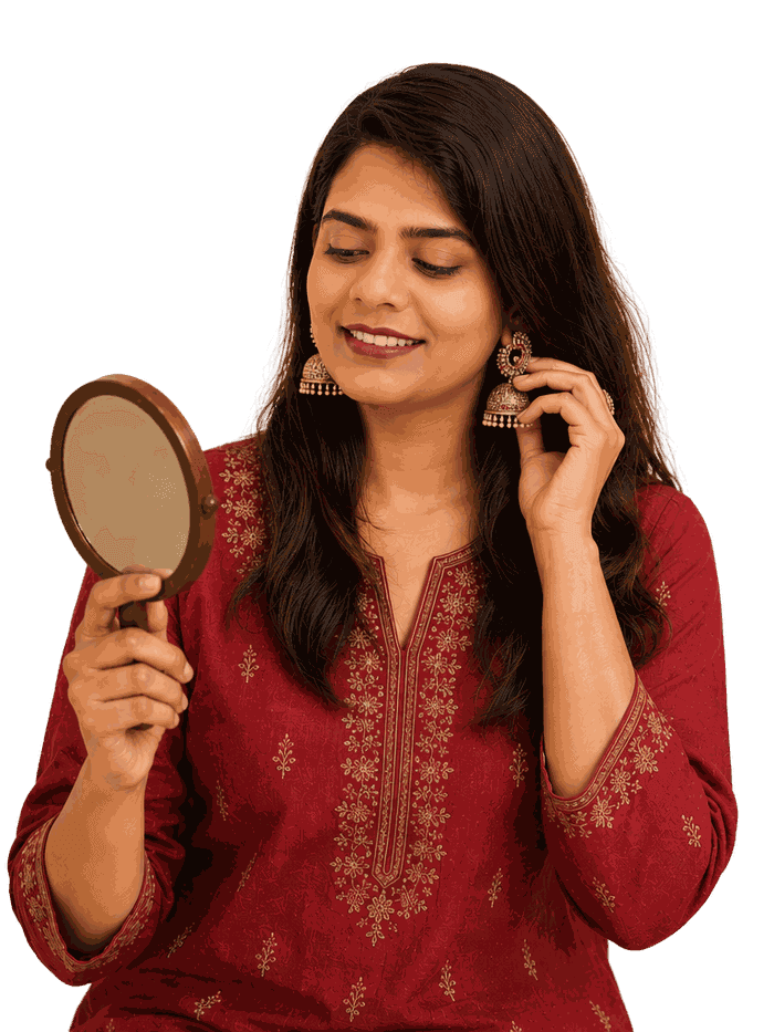 A customer trying on jhumka earrings from her Haaty order